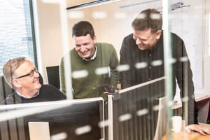 HHY_Three people smiling in front of a computer-600x400