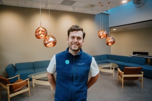 Ole Martin, project engineer in Norwegian Electric Systems, smiling to the camera in his navy blue 